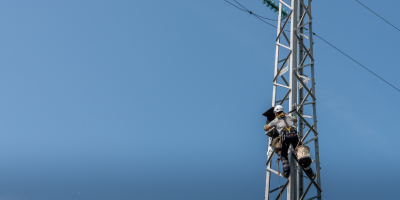 Worker on electric pylon